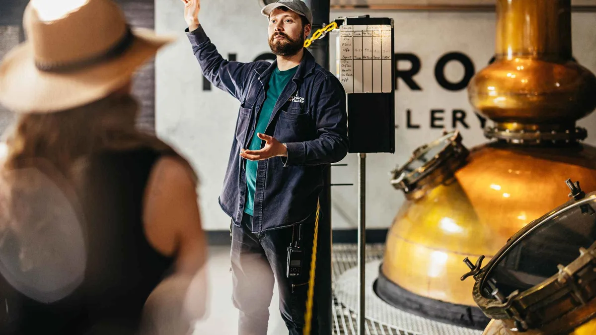 Copper stills and washbacks on the whisky floor of the Holyrood Distillery whisky and gin tour in Edinburgh